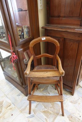 a chair that is sitting in front of a cabinet