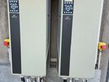 two machines that are sitting in the back of a truck