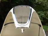 a white surfboard sitting on top of the back of a car