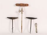 three different types of wine openers on a white surface