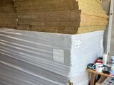 a large stack of hay stacked on top of a pallet