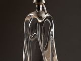 a glass bottle that is sitting on a table