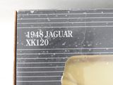 a box with a picture of a jaguar xk120 on it