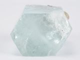 a large piece of ice that is sitting on a white surface