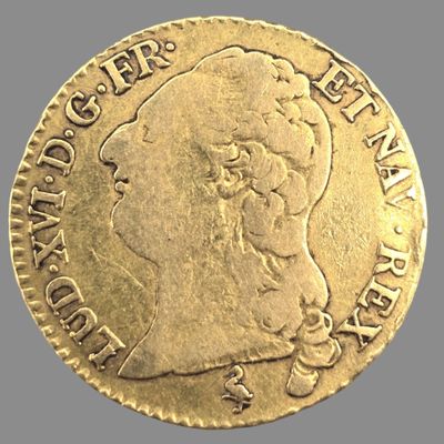 une pièce d'or représentant le profil d'un homme