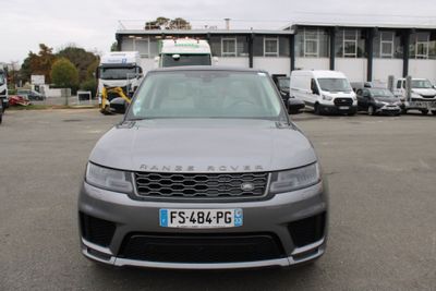 a grey range rover parked in a parking lot