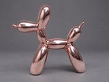 an image of a pink balloon dog sculpture on a grey background