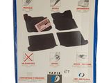 the box is open to show the contents of the car floor mats
