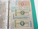 an open book with a bunch of different bills on it