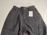 a close up of a pair of gray pants on a white surface