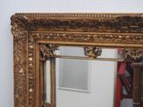 a mirror that is sitting on the wall in the room