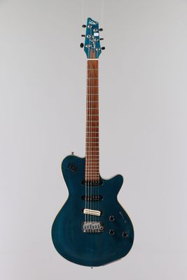 an electric guitar hanging from a ceiling in a room