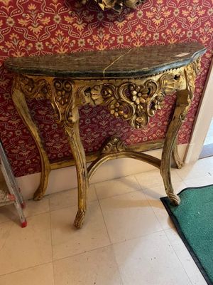 a small table with a mirror on top of it
