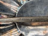 a close up of a metal object with a handle