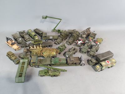 a lot of toy army vehicles that are on the table