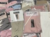 a pile of clothing that is sitting on a table