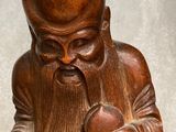 an image of a statue of a man holding a dog