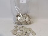 a bag full of coins sitting on a table