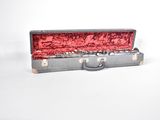 a silver case with a red lining on it