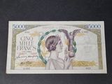 a picture of a bank note with a woman holding a bird