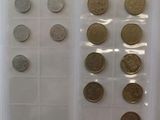 a lot of coins that are in a plastic container