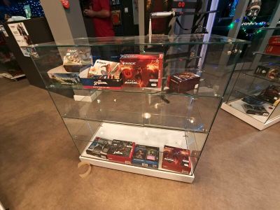 a glass display case with a lot of items inside of it