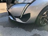 a close up of the front bumper of a silver car