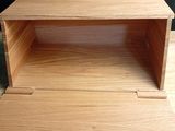 a close up of a small wooden box on a table