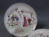 two plates with pictures of people on them on a table