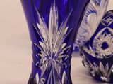 three blue vases sitting next to each other on a table