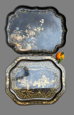 two trays that have been decorated with a picture of a city