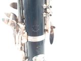 a close up of a clarinet with a white background