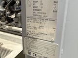 a label on the back of a machine that is in a factory