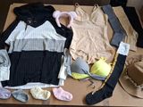 a box with clothes and a hat on top of it