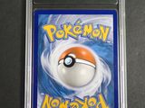a close up of a pokemon card in a plastic case