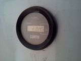 a digital clock mounted on the wall of a building