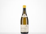 a bottle of wine sitting on top of a white table