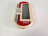 a red and white electronic device sitting on a white surface