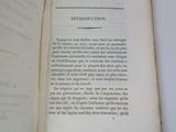 an open book with a black and white image of a man ' s face