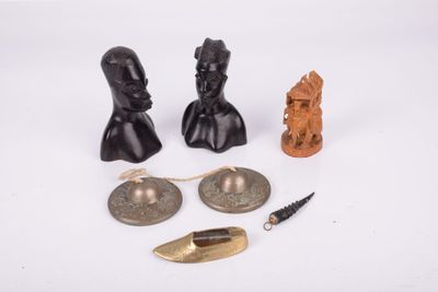 three pieces of bronze and bronze figurines are on a white surface