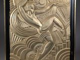 an art deco sculpture of a woman holding a surfboard