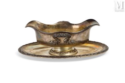 an antique silver plate with a bowl and saucer on it