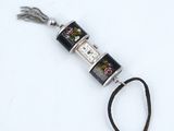 a silver and black clock on a black cord