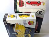 three boxes of toy cars sitting on top of each other