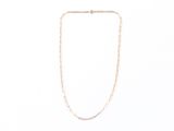 a close up of a necklace on a white background