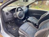 the interior of a car with the door open and the steering wheel down