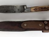 two knives that are sitting side by side on a table