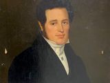 portrait d'un homme en manteau noir et chemise blanche