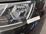 a close up of a car ' s headlight with a sticker on it