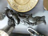a statue of a woman laying on a plate
